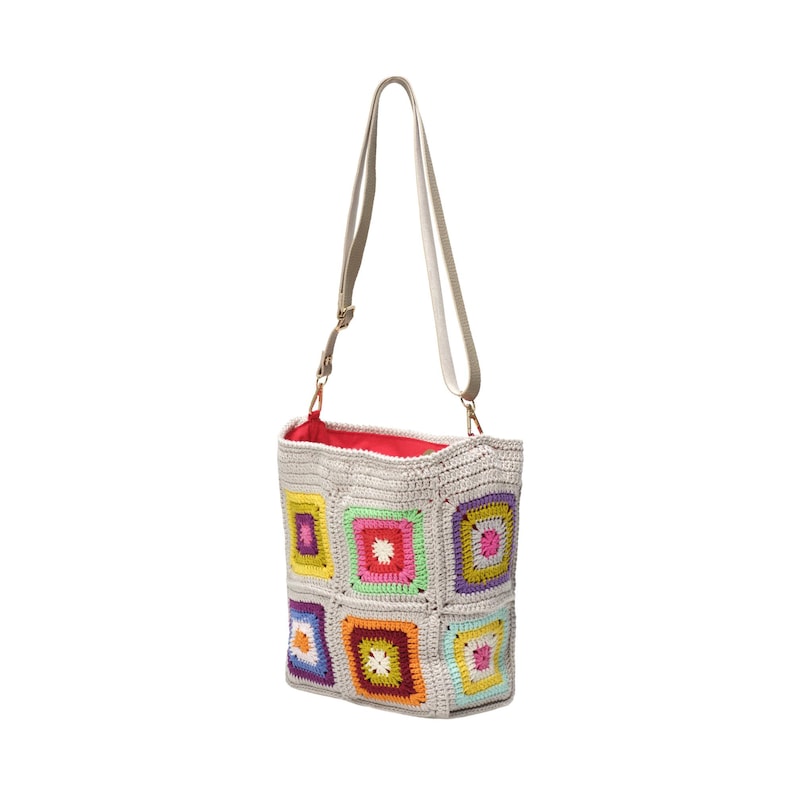 May include: A beige crochet shoulder bag with a colourful patchwork design. The bag has a rectangular shape, a red interior lining, and a long, adjustable strap. The patchwork squares are in various colours.