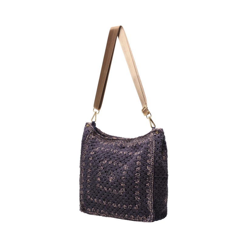 May include: A dark purple crochet shoulder bag featuring a square pattern design. The bag includes a wide, adjustable beige nylon strap attached with gold-toned metal swivel clasps on each side, providing a functional and textured accessory.