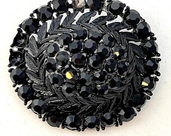 Vintage Lisner brooch with Black rhinestones, domed oval shape