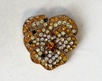 Vintage amber rhinestone brooch by Capri with sparkling pansy flower shape, undulating petals, gold tone details, and signature stamp