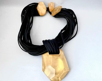 Vintage Monies statement necklace, multi strand black leather with gold toned faceted pendant and toggle clasp, oversized chunky fabulous