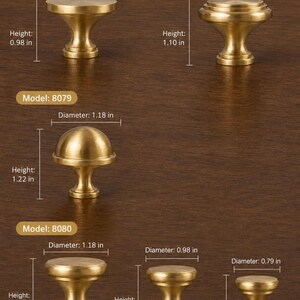 May include: A collection of six brass-toned cabinet knobs labeled by model numbers 8077, 8078, 8079, and 8080. Each knob displays specific dimensions in inches, including diameters ranging from 0.79 to 1.38 inches and heights from 0.65 to 1.22 inches.