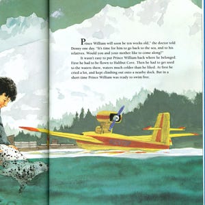 May include: Illustration from a children's book featuring a yellow seaplane with red accents on the water. The text reads "Prince William will soon be ten weeks old." A seal and a person are also visible.