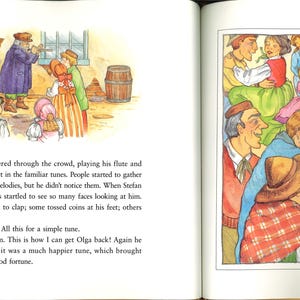 May include: A vibrant illustration from a children's book shows a gathering of people in traditional attire. A man plays a flute, with others dancing and listening. The scene is rich with warm colours and a sense of community.