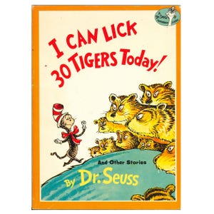 May include: A vintage paperback book cover with the title "I Can Lick 30 Tigers Today!" in red letters. The cover features illustrations of the Cat in the Hat and several tigers, with the author's name, Dr. Seuss, at the bottom.