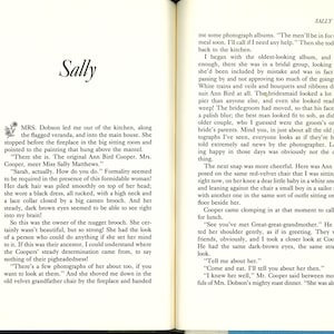 May include: An open book with text on aged paper. The title "Sally" is at the top of the left page. The text is in a serif font, and the pages are slightly yellowed, suggesting age.