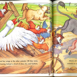 May include: A vibrant illustration from a children's book shows farm animals in a lively scene. A large white goose flaps its wings, surrounded by chickens and other animals running across a green field. The text reads, "Olga honked and flapped her wings..."