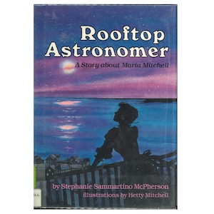 May include: A vintage book cover titled "Rooftop Astronomer: A Story about Maria Mitchell." The cover features a silhouette of a person looking at a moonlit ocean under a purple and blue sky. The author is Stephanie Sammartino McPherson, with illustrations by Hetty Mitchell.