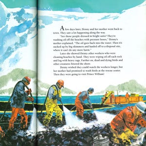 May include: Illustration from a children's book depicting workers in orange and yellow suits using pressure hoses to clean an oil spill on a beach. The scene includes text from the book.