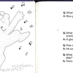 May include: An open book with a black and white illustration of two dancing ghost figures surrounded by musical notes. The right page contains a series of Halloween-themed jokes and answers.