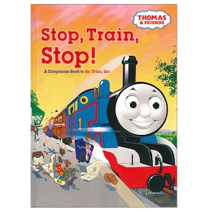 May include: A children's book cover featuring Thomas the Tank Engine. The title "Stop, Train, Stop!" is in large red letters. The cover shows a blue train with a smiling face, a woman running, and luggage scattered on a platform.