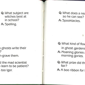 May include: Open book pages with Halloween-themed illustrations. One page features a purple witch with a wand and the letter "B". The other page shows a ghost wearing glasses. Text includes Halloween-related questions and answers.