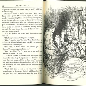 May include: An illustration from a book depicting a scene with three figures attending to a man lying down. The image is in black and white, with detailed linework, suggesting a vintage style. The scene is set outdoors, with a lantern visible.