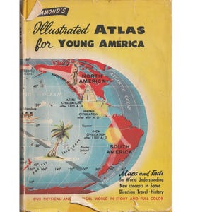 May include: A yellow book cover with the title "Illustrated Atlas for Young America". The cover features a world map with a red and blue color scheme, highlighting North and South America. The text "Maps and Facts for World Understanding" is also visible.