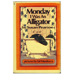 May include: A hardcover book titled Monday I Was An Alligator by Susan Pearson with pictures by Sal Murdocca. The cover features an illustration of a dark green alligator in a white claw-foot bathtub against a yellow curtain with blue stars.