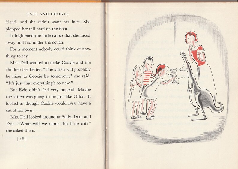 May include: A black and white illustration of a kangaroo with a small kitten in its pouch. A woman and three children are standing in front of the kangaroo. The text "Evie and Cookie" is at the top of the page.