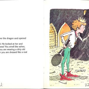 May include: A book page illustration showing a prince in a white shirt, green pants, and red shoes holding a tennis racket, pointing at a princess in a paper bag dress. The text reads: Elizabeth walked right over the dragon and opened the door to the cave.