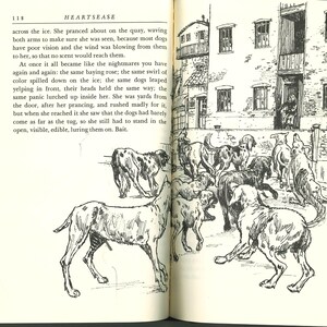 May include: An open book with a black and white illustration of several dogs in a courtyard. The dogs are of various breeds, some with spots. A building with windows and a balcony is in the background. Text on the page reads "HEARTSEASE".