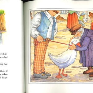 May include: A vibrant illustration from a children's book shows a market scene. Two men are interacting with a white goose, while other figures browse stalls. The artwork features detailed clothing and a rustic setting, creating a storybook atmosphere.