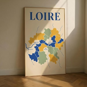 May include: A framed art print featuring a map of the Loire region in France. The map is in shades of blue, yellow, and green, with the word "LOIRE" in blue at the top. The cities of Nantes, Angers, Tours, and Saumur are labeled.