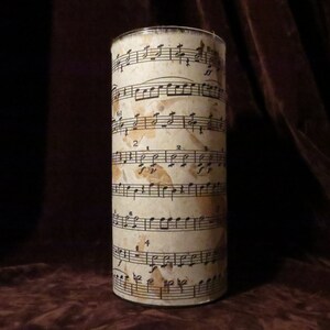 Natural leaf candleholder with sheet music design. Each one is an original piece of art.