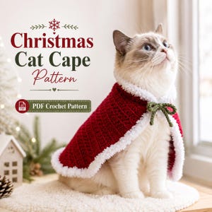 May include: A cat wearing a red and white crocheted Christmas cape with a green bow. The image includes the text "Christmas Cat Cape Pattern" and "PDF Crochet Pattern". The cat is sitting on a white surface.