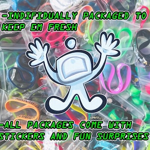 May include: A selection of brightly coloured rubber wristbands in individual clear plastic packets. A cartoon figure with raised arms is in the centre. Green text reads, "-INDIVIDUALLY PACKAGED TO KEEP EM FRESH" and "-ALL PACKAGES COME WITH STICKERS AND FUN SURPRISES!"