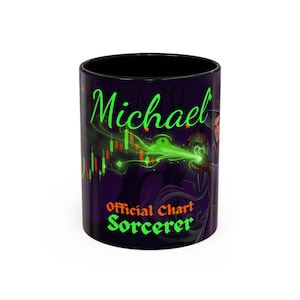 May include: A black ceramic mug featuring a graphic of a sorcerer casting a green spell over a financial candlestick chart. The text Michael appears in green script at the top, with the orange and green text Official Chart Sorcerer below.