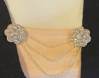 Suéter Clips: flores de plata tachonadas de diamantes de imitación