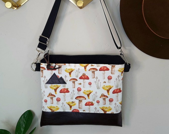 Small crossbody/MUSHROOM print-front and back = pocket/Black zipper/Black canvas/Black nylon adjustable strap