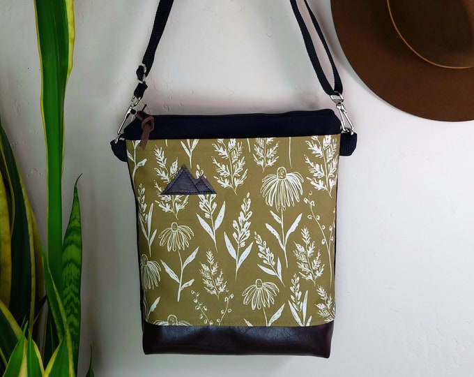 Medium crossbody/OLIVE FLORAL print front = pocket/Black zipper/Black canvas reverse/Black nylon adjustable strap