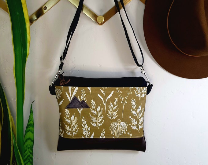 Small crossbody/OLIVE FLORAL print front = pocket/Gray & white/Black zipper/Black canvas/Black nylon adjustable strap/MT or Mountain patch