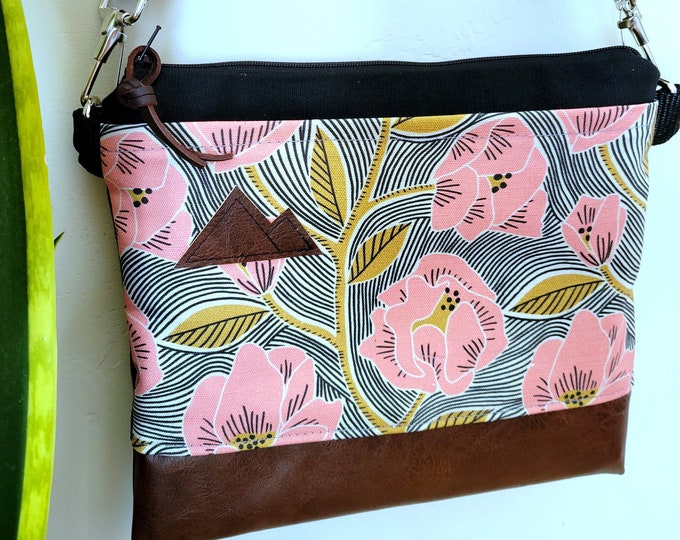 Small crossbody/FLAMINGO FLORAL print front = pocket/Black zipper/Black canvas/Black nylon adjustable strap/Mountain or MT patch