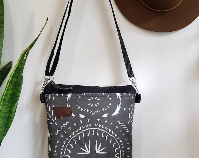 Medium crossbody/Bohemian print in charcoal = front pocket/Black zipper/Black canvas reverse/Black nylon adjustable strap