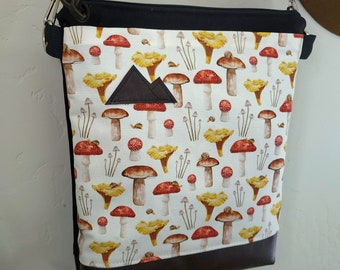 Medium crossbody/MUSHROOM print front = pocket/Black zip/Black canvas reverse/Black nylon adjustable strap/Mountain or Montana patch