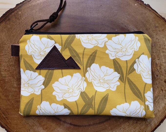 Golden floral pouch/3 size options/printed front and back/Natural canvas liner/Black zipper/Mountain or Montana patch/Vegan leather details