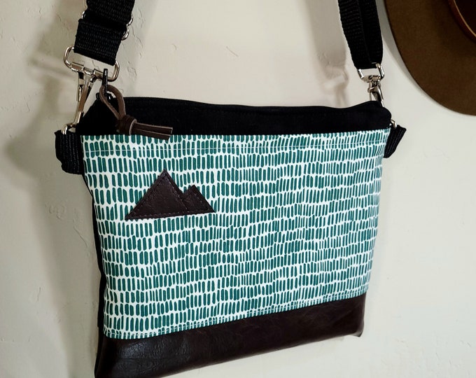 Small crossbody/DASHING print in cactus front = pocket/Black zipper/Black canvas/Black nylon adjustable strap