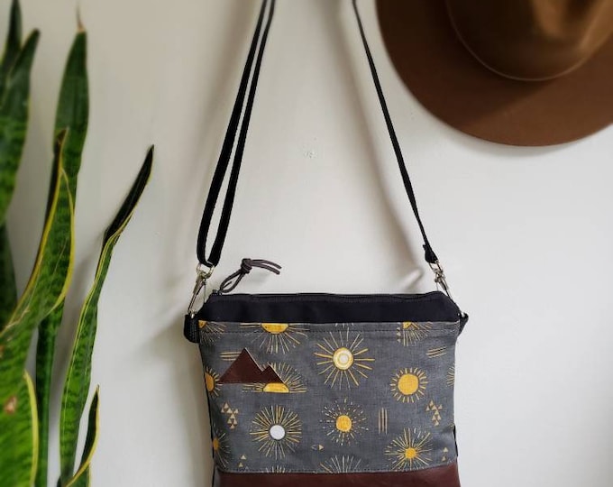 Small crossbody/Shine print in charcoal = front pocket/Black zipper/Black canvas reverse/Black nylon adjustable strap/Mountain or MT patch