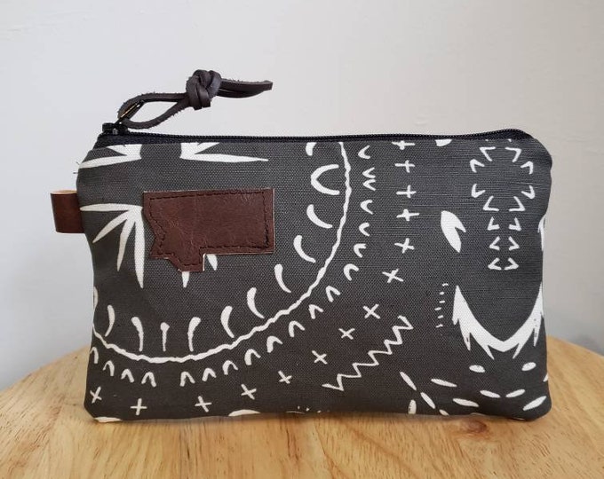 3 size options/Bohemian print in charcoal = front and back/Natural canvas liner/Black zipper/Mountain or Montana patch