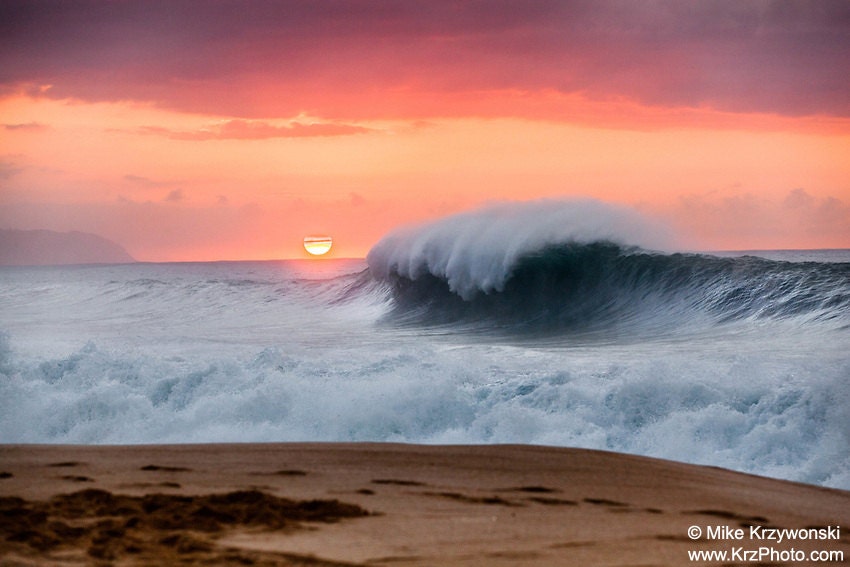 Big Wave Breaking Under an Orange Sunset on the North Shore of