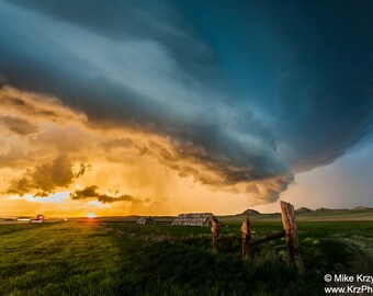 Supercell thunderstorm above hay bales during sunset in Montana photo picture fine art metal print