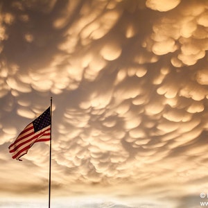 Golden Mammatus Clouds at Sunset above the U.S. Flag in Dodge City, Kansas photo picture fine art metal print