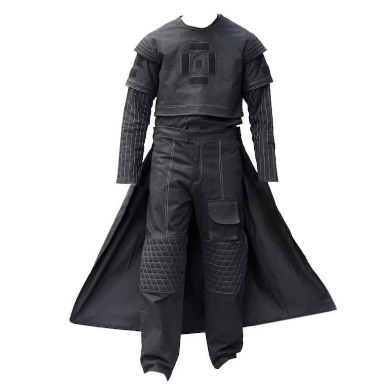May include: A black outfit consisting of a short-sleeved top with a square chest emblem, long sleeves with vertical pinstripes, and trousers featuring quilted knee panels, a side cargo pocket, and a long, flowing back panel or cape attachment.
