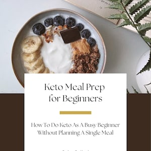 May include: A bowl of yogurt topped with blueberries, banana slices, granola, a square of dark chocolate, and a dollop of nut butter. The text reads: Keto Meal Prep for Beginners, How To Do Keto As A Busy Beginner Without Planning A Single Meal, Suha Sajjad.