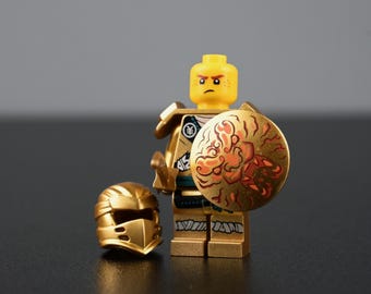MOC- Ninjago DIY Golden Ninja Minifigure – Black Logo, Turquoise Belt, with Japanese Pattern
