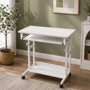 May include: A white mobile computer desk featuring a rectangular tabletop, a sliding keyboard tray, and a lower storage shelf. The desk is supported by a white metal frame with adjustable height knobs on each side and four black caster wheels.