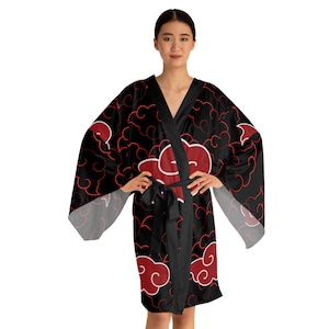 May include: Black kimono robe featuring a red cloud pattern. The robe has a V-neck, long sleeves, and a matching black belt. The cloud design is repeated across the robe's surface.