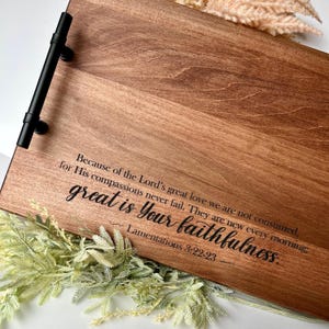 May include: A rectangular wooden serving tray with a dark stain and black handles. The tray features the text "great is Your faithfulness" and a Bible verse. Decorative greenery is at the bottom.