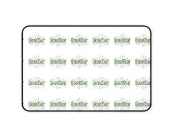 hustler pattern Desk Mat | repeating logo, minimalist green text