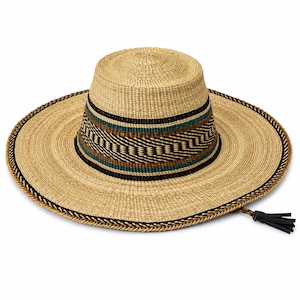 May include: A wide-brimmed straw hat featuring a flat crown and a woven texture. The hat is decorated with a band of black, teal, and brown geometric patterns around the base of the crown. A braided cord with a black tassel hangs from the brim.